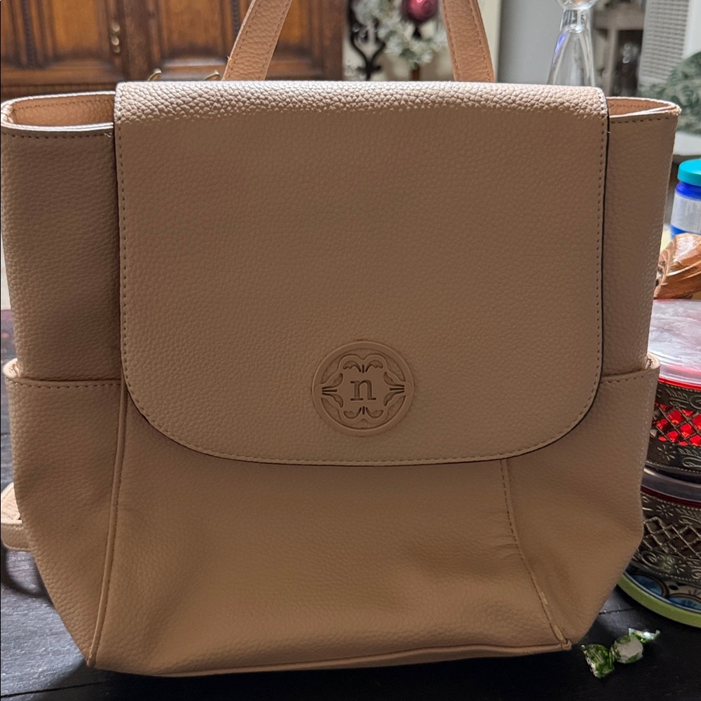 Nanette Lepore pebbled vegan leather backpack in a light pink or beige color. - Picture 6 of 9
